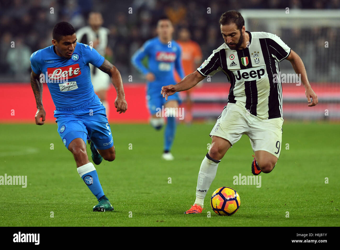 Juventus Stadium, Turin, Italy. 29th Oct, 2016. Serie A Football. Juventus versus Napoli. Gonzalo Higuain shields the ball from Allan © Action Plus Sports/Alamy Live News Stock Photo