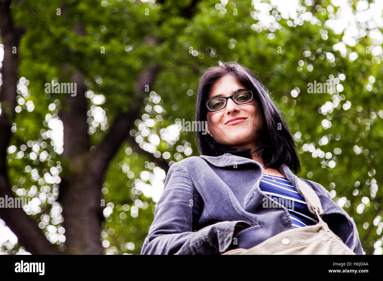 Portrait of a woman in the park at the afternoon Stock Photo - Alamy
