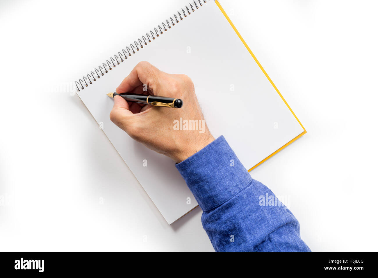 man's hand writing with a fountain pen. isolated Stock Photo - Alamy