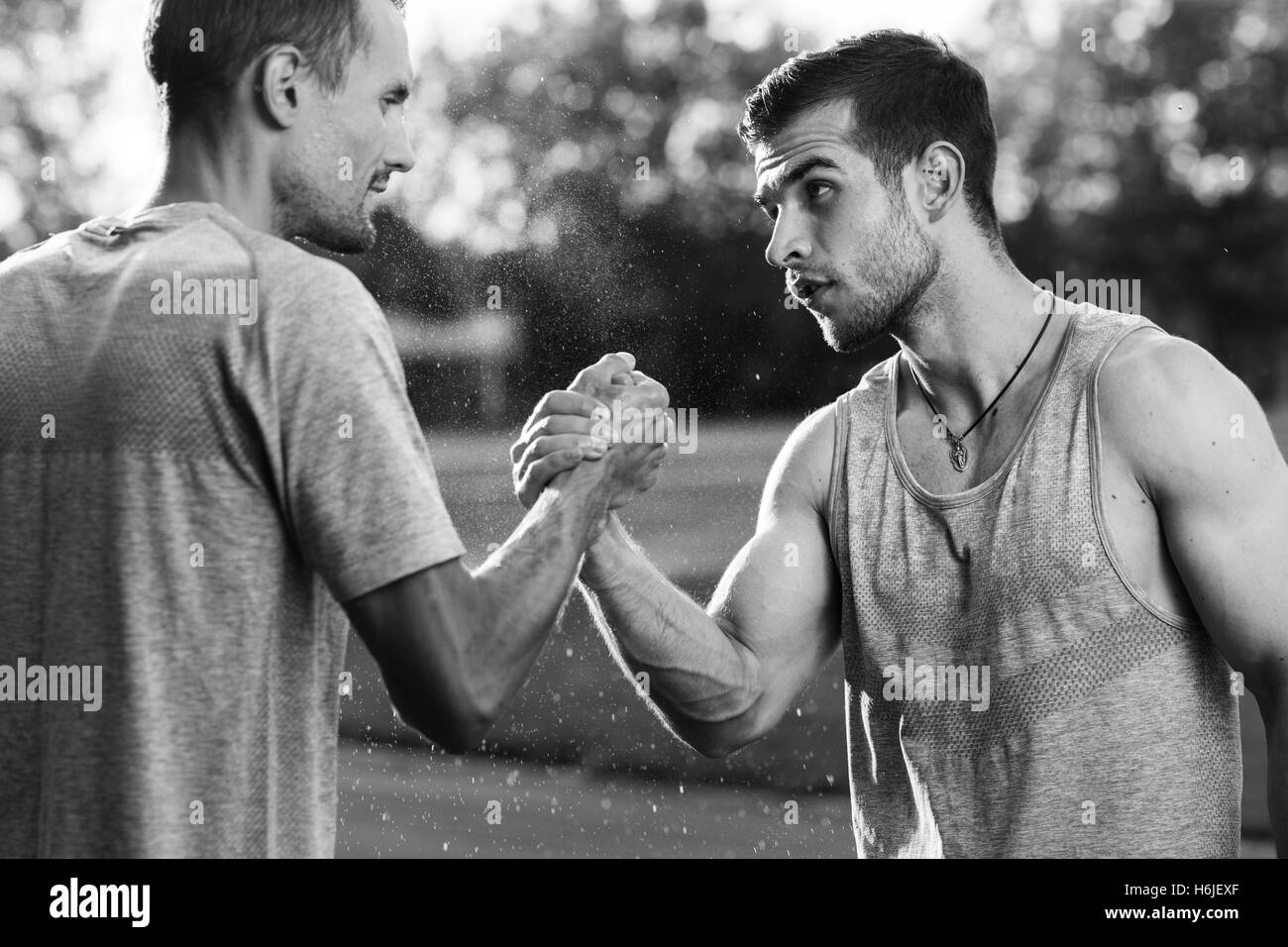 Black and white portrait of handsome men with arm wrestling Stock Photo