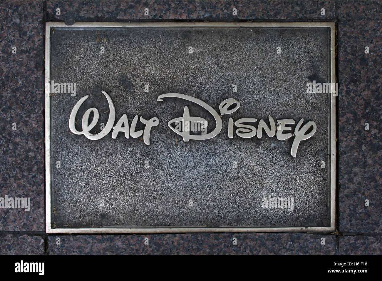 Plaque with the logo of Walt Disney, Leicester Square, London, UK. Stock Photo