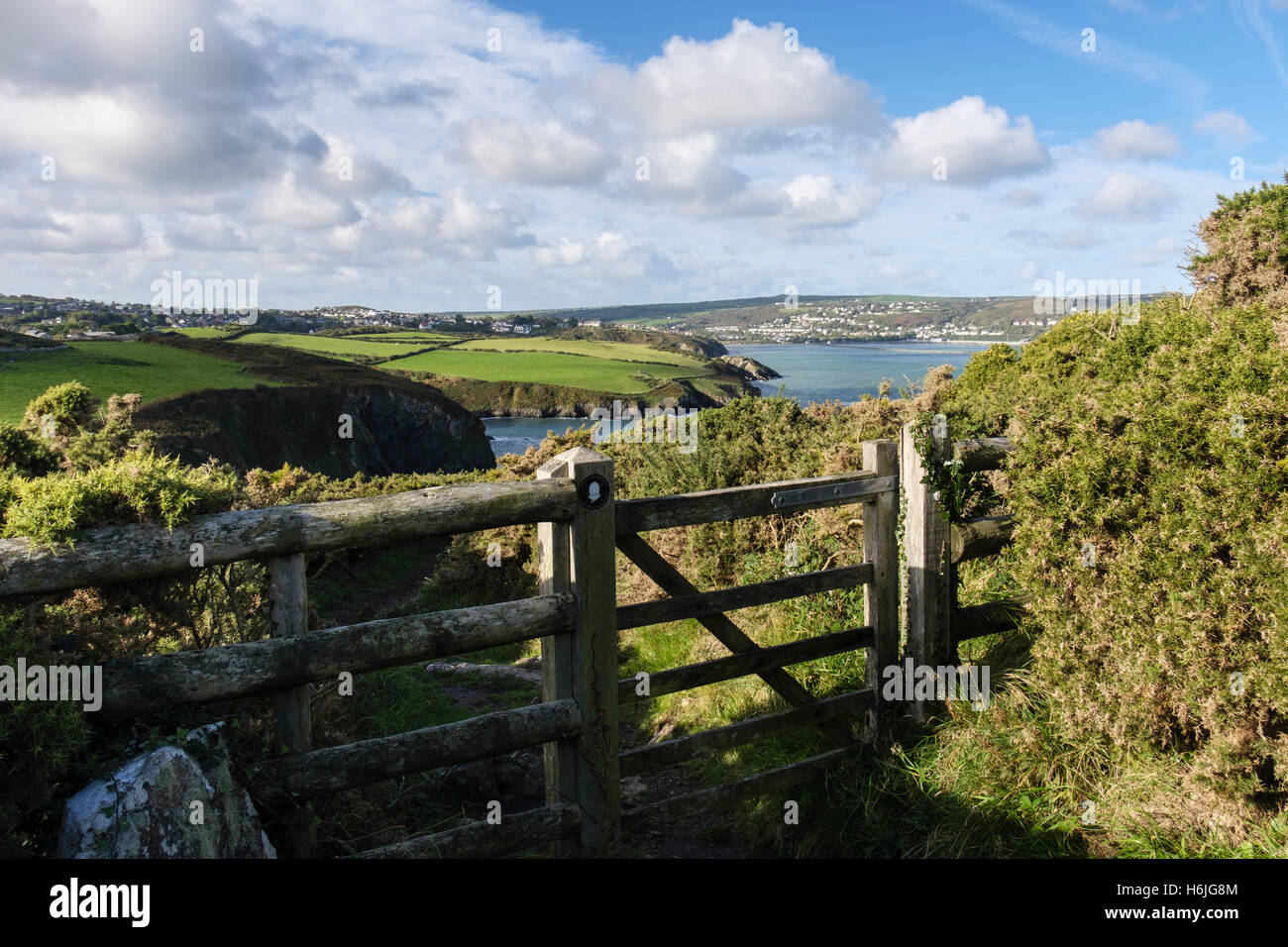 Gate with logo on Wales Coast Path national trail in Pembrokeshire Coast National Park. Fishguard Pembrokeshire Wales UK Britain Stock Photo