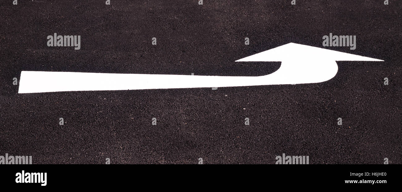 New road marking, an arrow pointing left Stock Photo