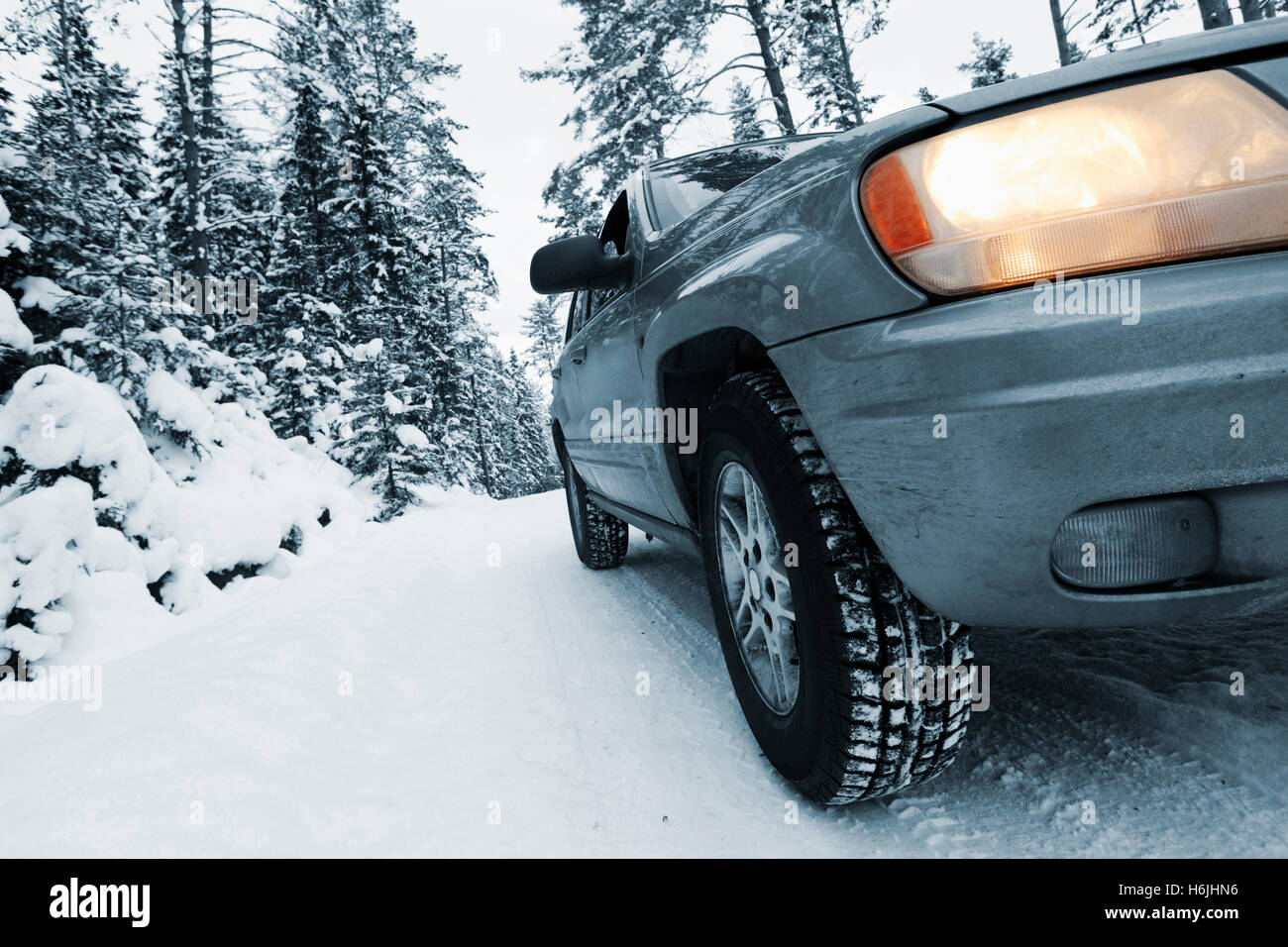 4x4, car driving in snowy and rough conditions Stock Photo