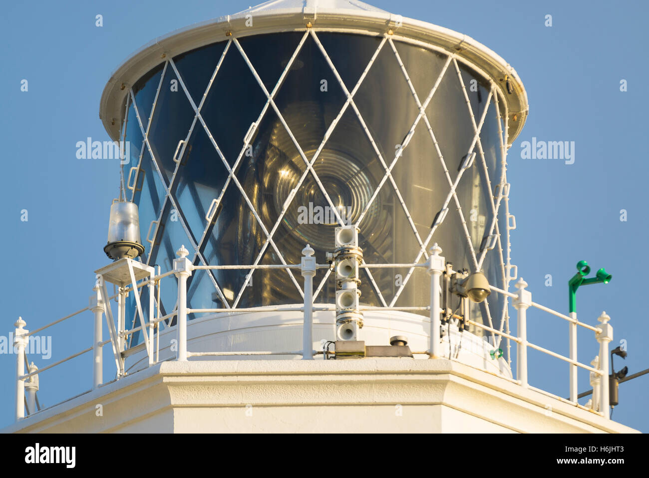Close-up of lighthouse tower and lamp at the southernmost cape of Great Britain Lizard Point, Cornwall, England at sunrise Stock Photo