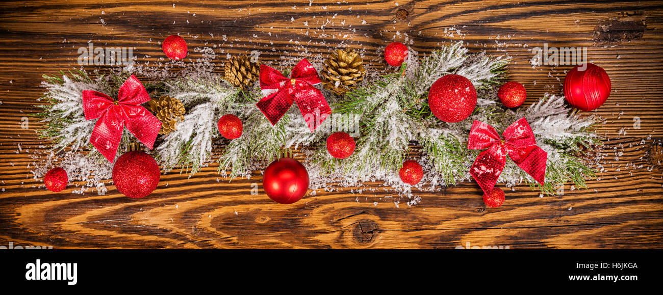 Christmas decoration with fir branches placed on old wooden planks ...