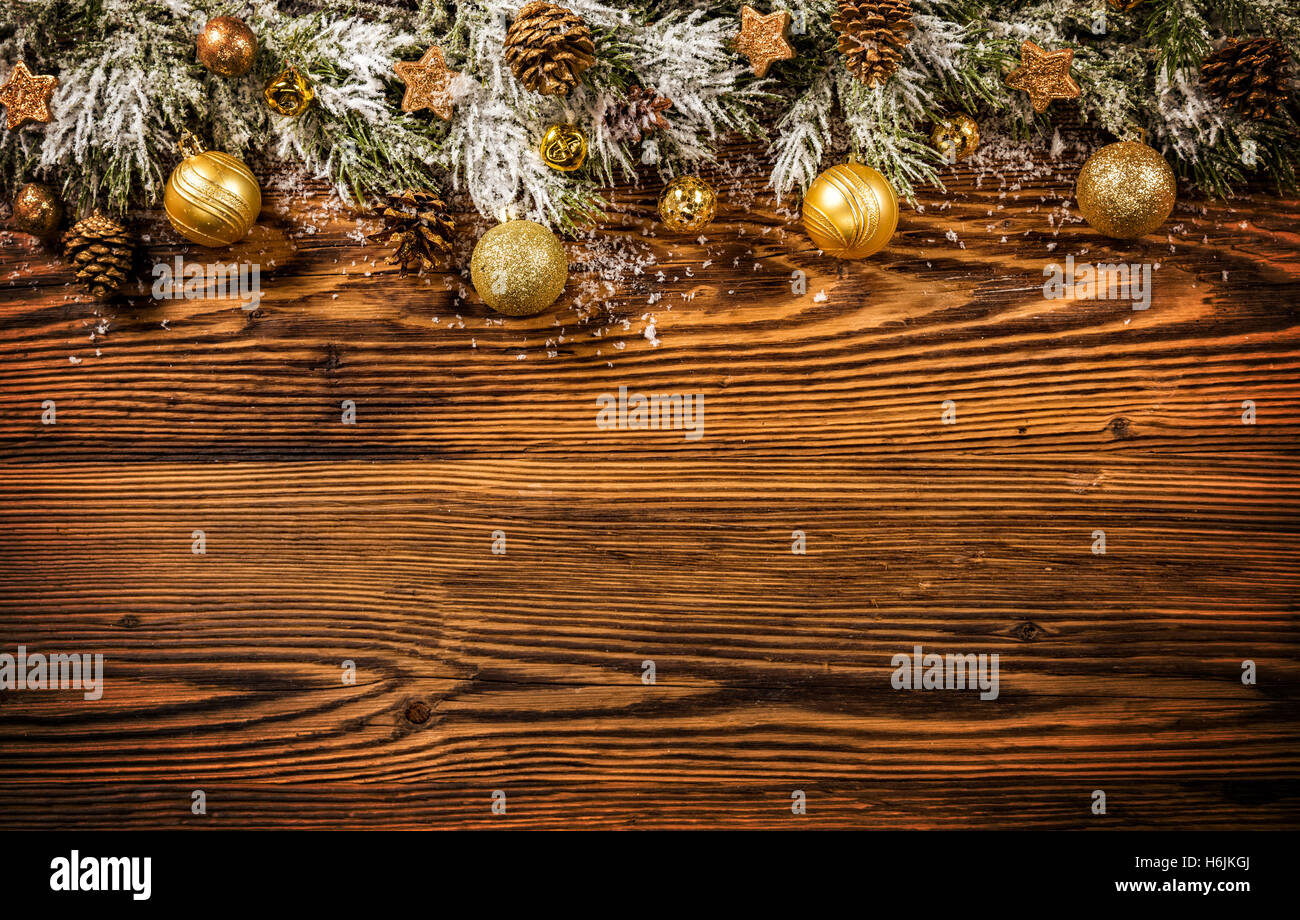 Christmas decoration with fir branches placed on old wooden planks ...
