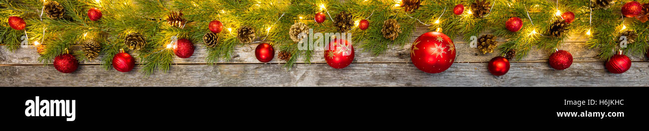 Christmas lights with fir decoration placed on old wooden planks Stock ...