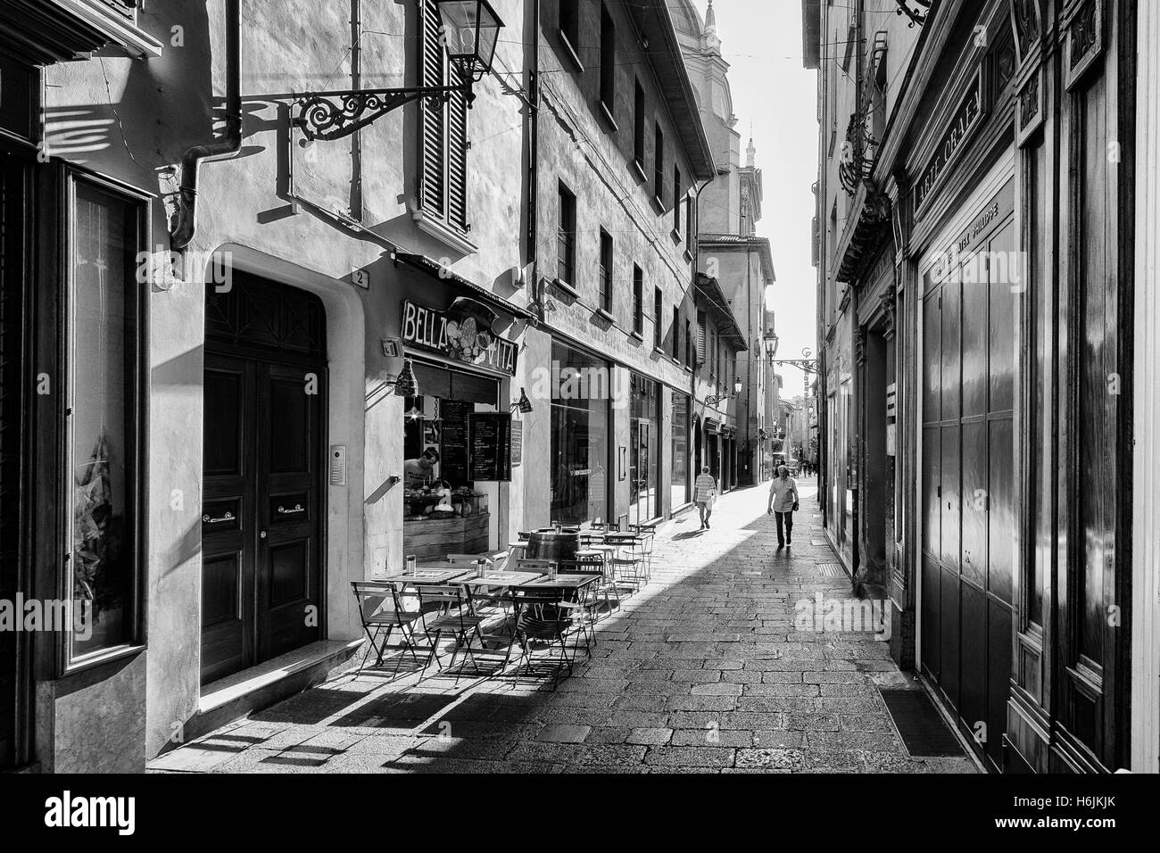 Bologna, Italy - September 04, 2016: People walk in a small street in the historic center of Bologna, in Italy Stock Photo