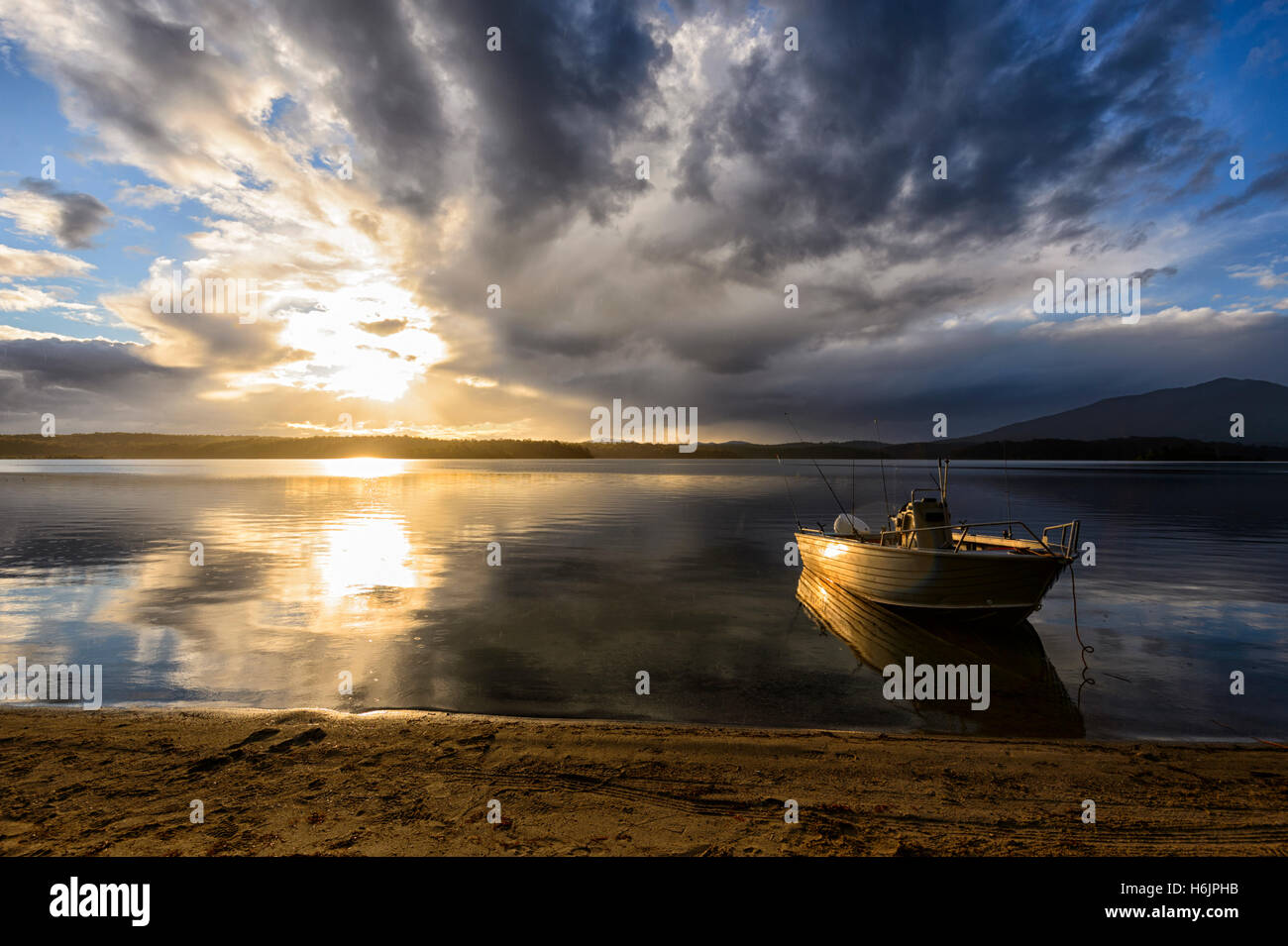 Sunset and threatening clouds over Wallaga Lake, near Bermagui, South Coast, New South Wales, Australia Stock Photo
