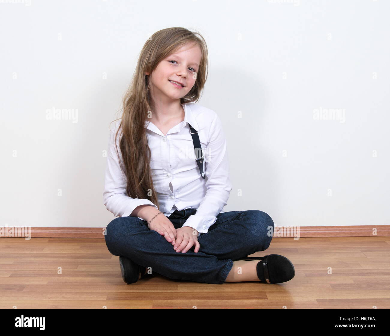 pretty girl portrait sitting on floor Stock Photo - Alamy