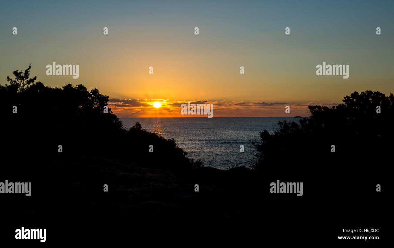 Silhouette Sunrise at Playa d'en Bossa, Ibiza Stock Photo