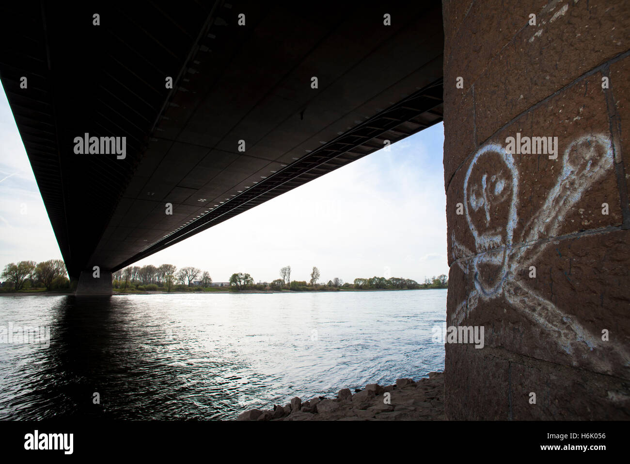 Germany, Leverkusen, the river Rhine bridge of the Autobahn A1 between Leverkusen and Cologne, skull and crossbones on a pier of Stock Photo
