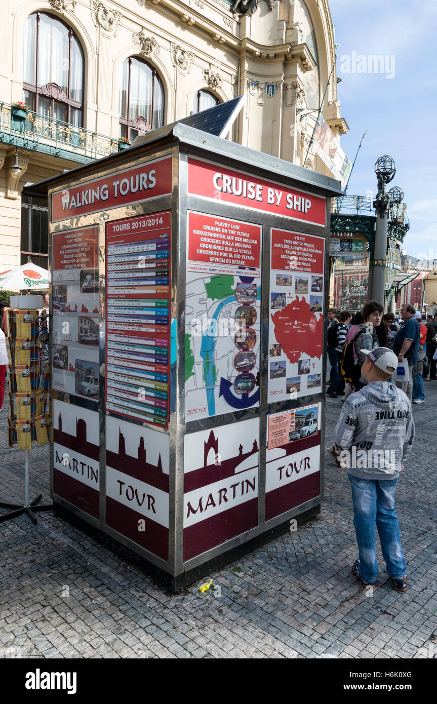 A young tourist at one of the  Prague city tours stands in Náměstí Republiky ( Republic Square), Prague, Czech Republic. Stock Photo
