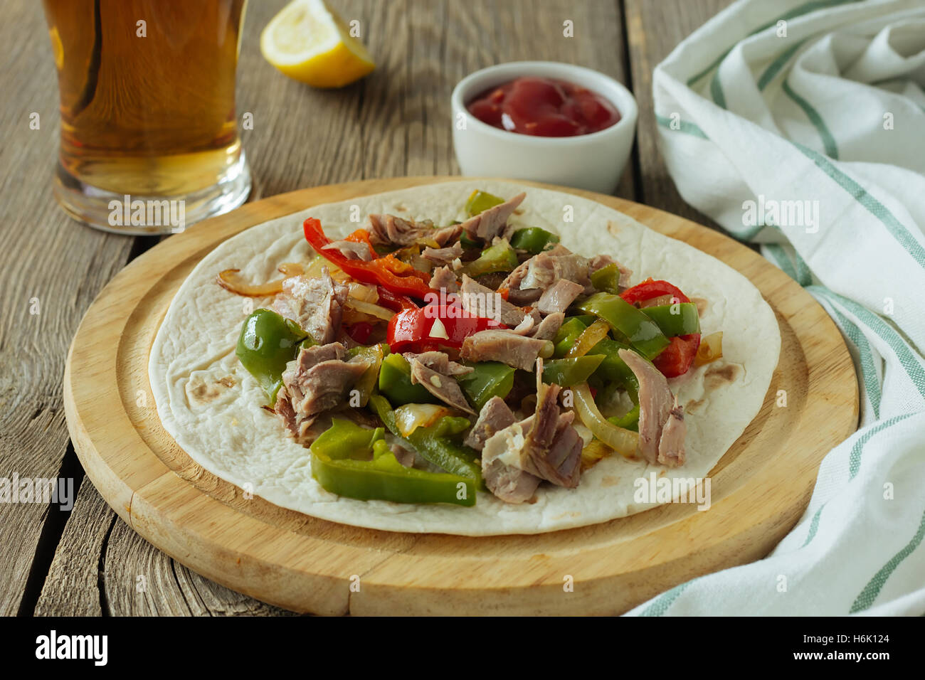 Tortilla with meat and sweet pepper selective focus Stock Photo