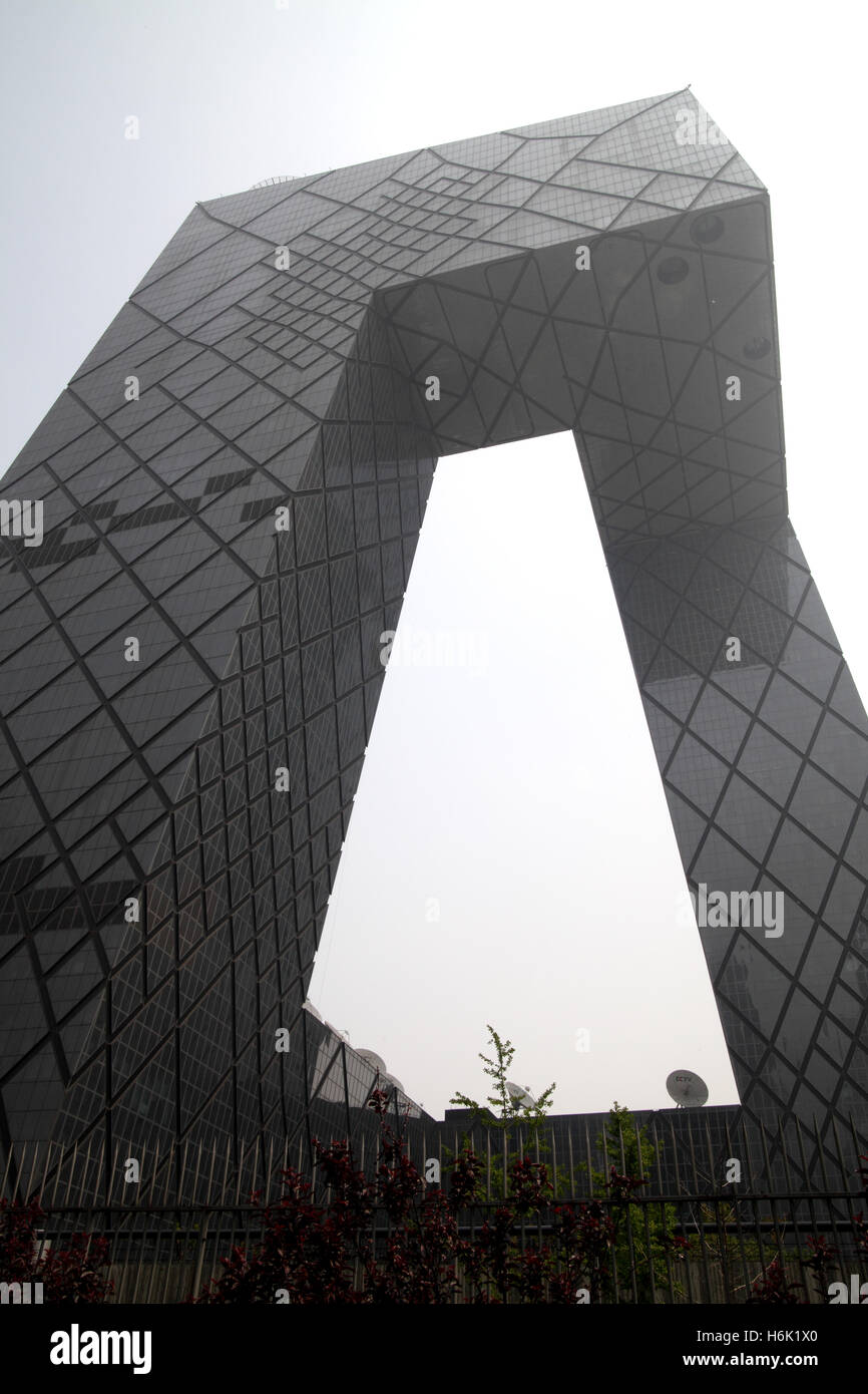 CCTV of China on a foggy day, it is a modern building looking like a gate, it was designed by the Dutch architect Rem Koolhaas. Stock Photo