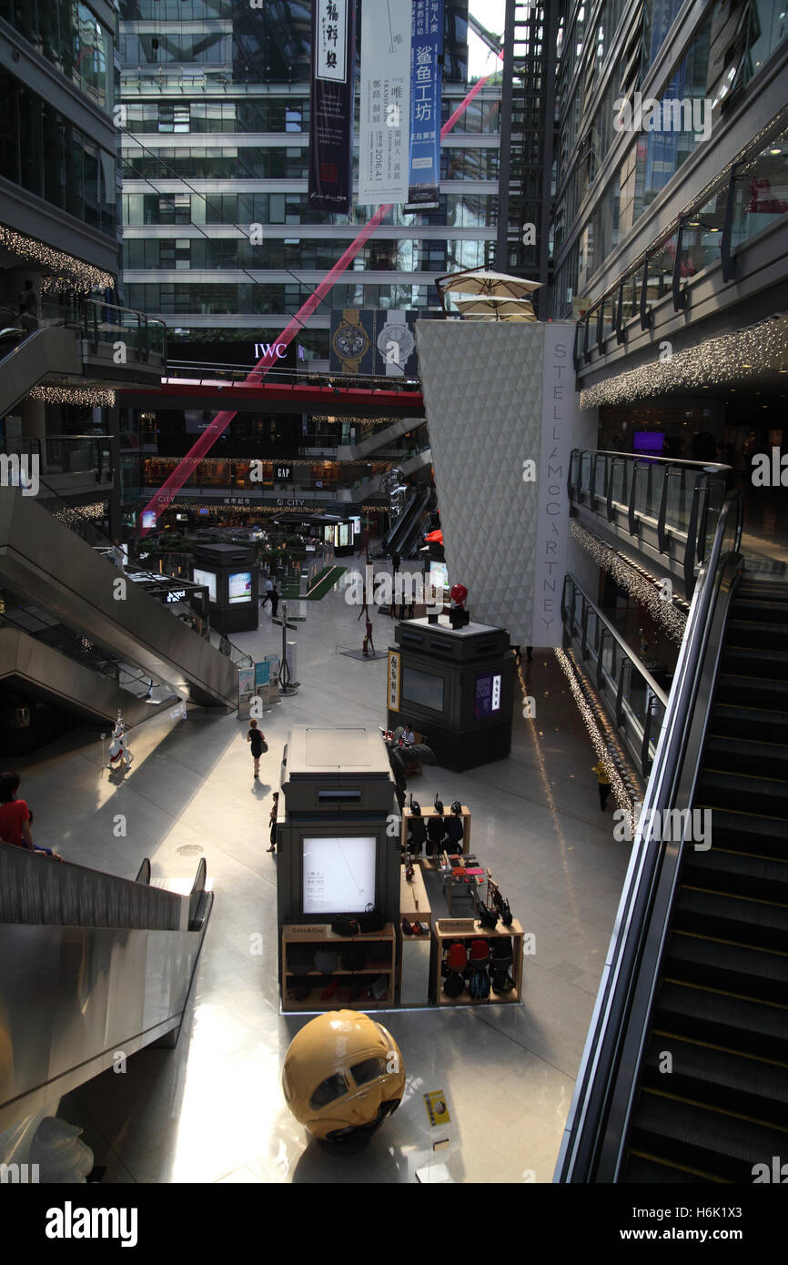 Interior of Parkview Green, a prestigious shopping center whose glass roof and walls let light through to save electricity. Stock Photo