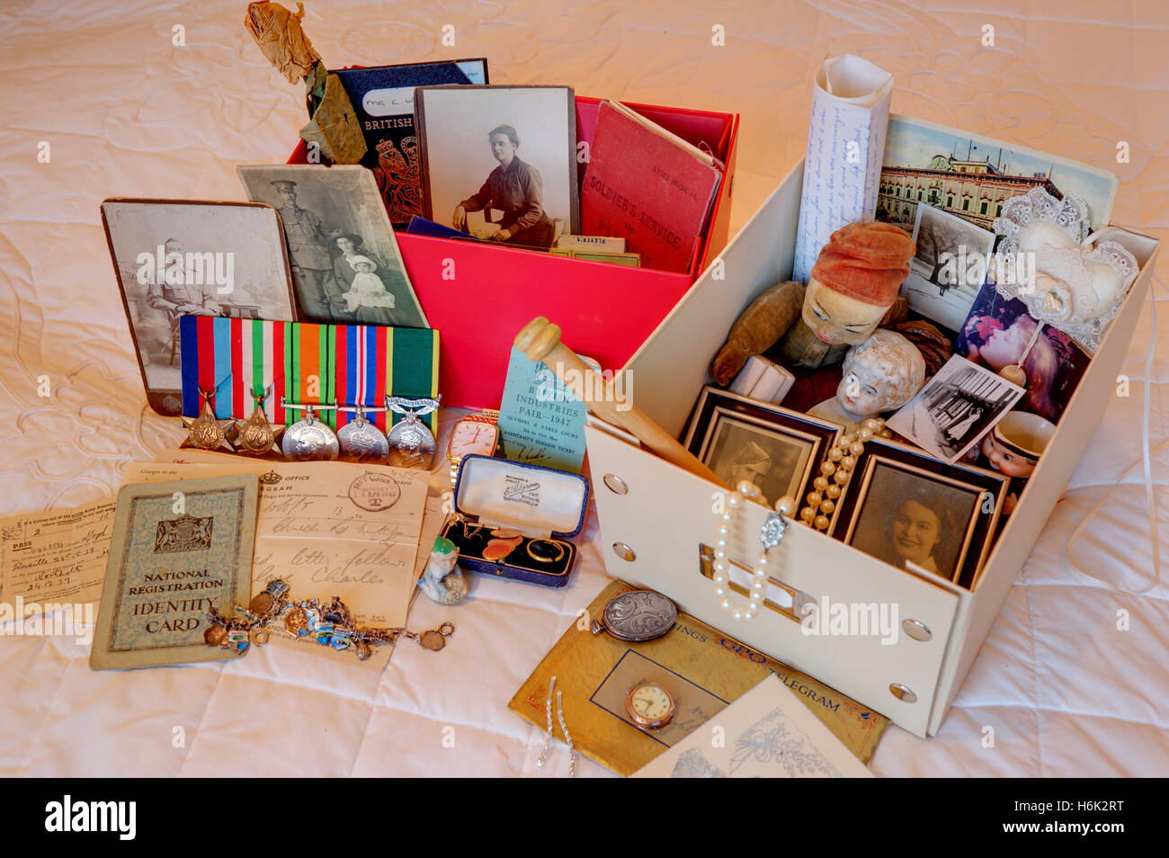Selection of personal memorabilia spilling out from memory boxes Stock