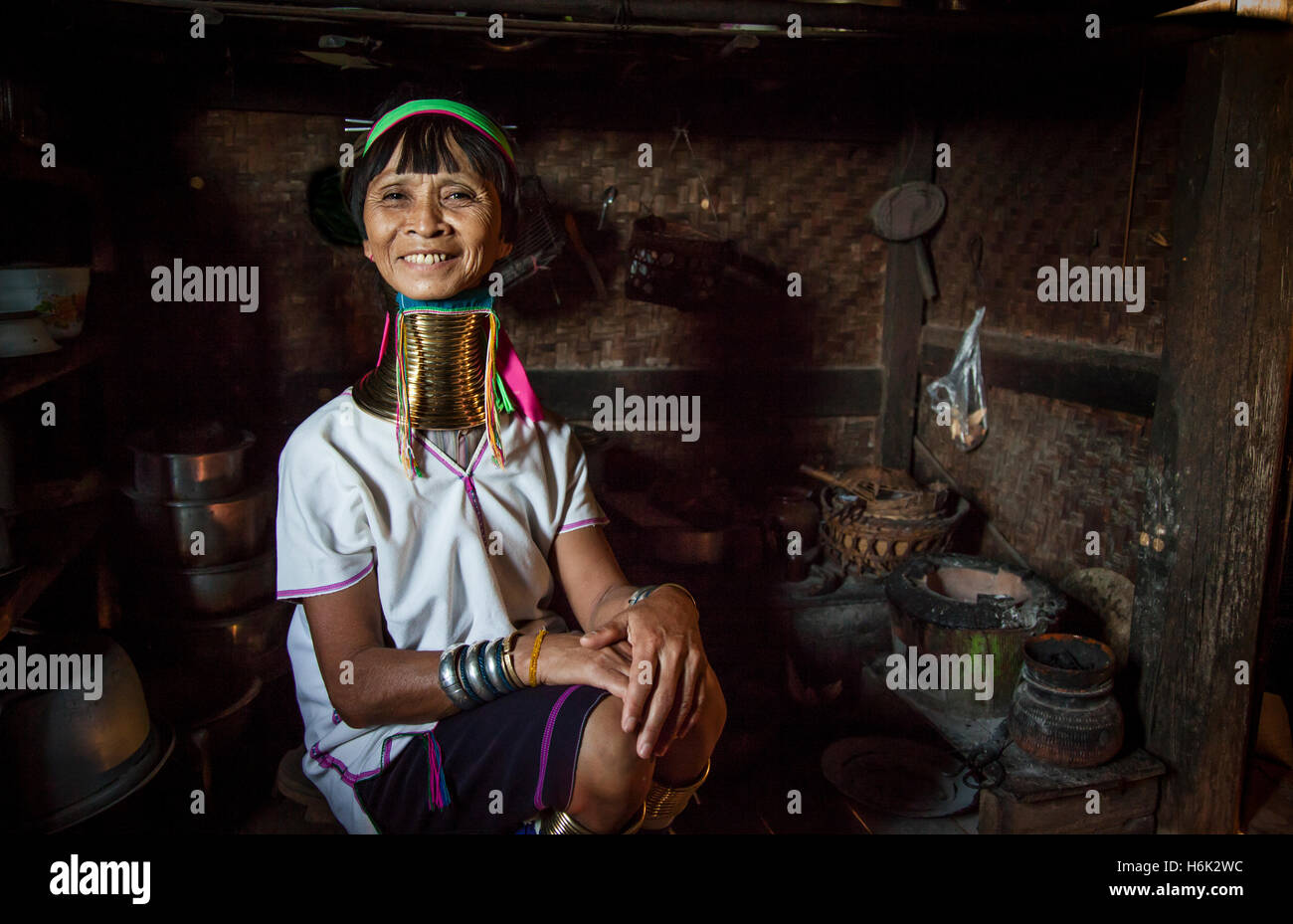 Lake Inle, Myanmar, 17th November, 2014: Kayan tribe woman in her kitchen posing Stock Photo
