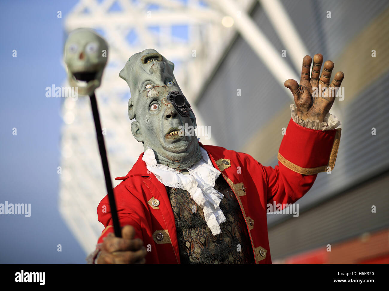 People dressed in Halloween costumes meet fans before the Premier