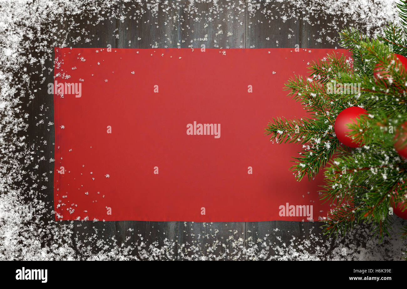 Christmas New Year background. Top view of wooden desk with christmas tree, tablecloth and snowflakes. Stock Photo