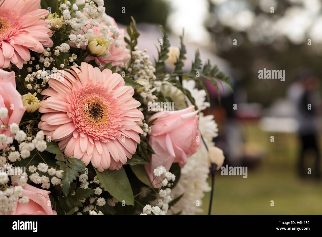 Bouquet of pink roses and pink gerbera daisies in a wedding flower arrangement Stock Photo Alamy