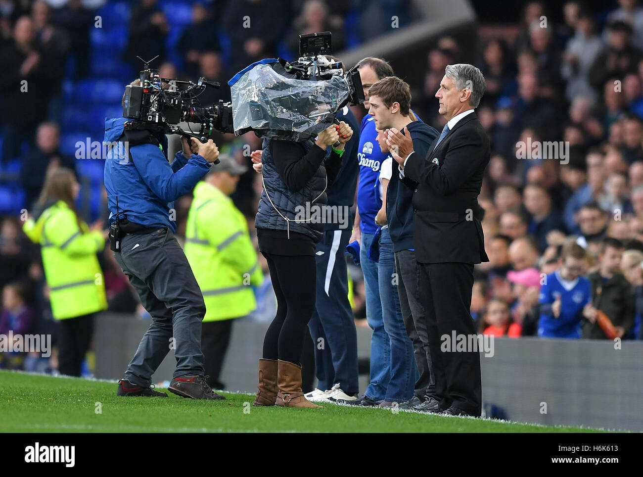 Actors filming a recreation of the moment when the parents and brother of Evertonian Rhys Jones were applauded by the Goodison Park crowd Stock Photo