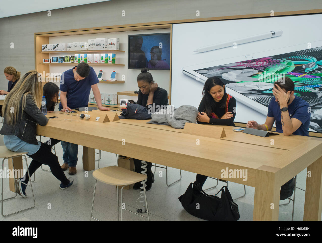 Customers and staff at the refurbished Apple store in Regent's St. London, UK Stock Photo Alamy