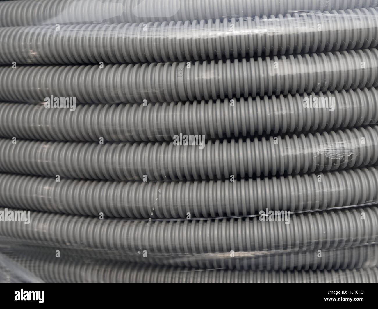 Gray flexible ERC cable management hose, bulk pack, 20mm Stock Photo