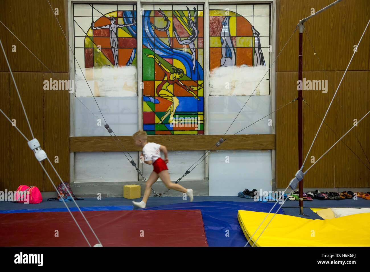 Young gymnast trains at the CSKA gymnasium in Moscow, Russia Stock Photo