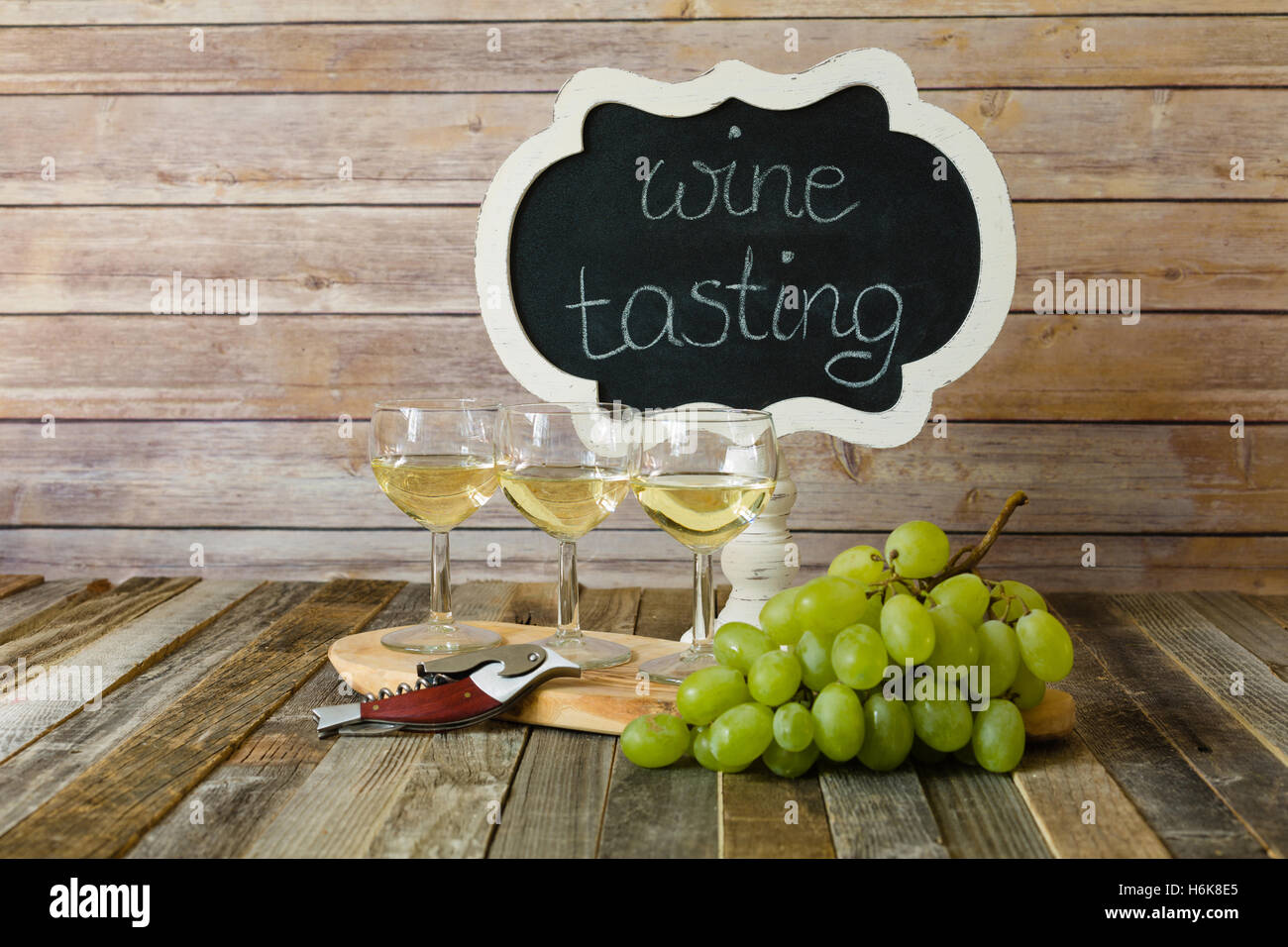 White wine flight with chalkboard sign and grapes Stock Photo Alamy
