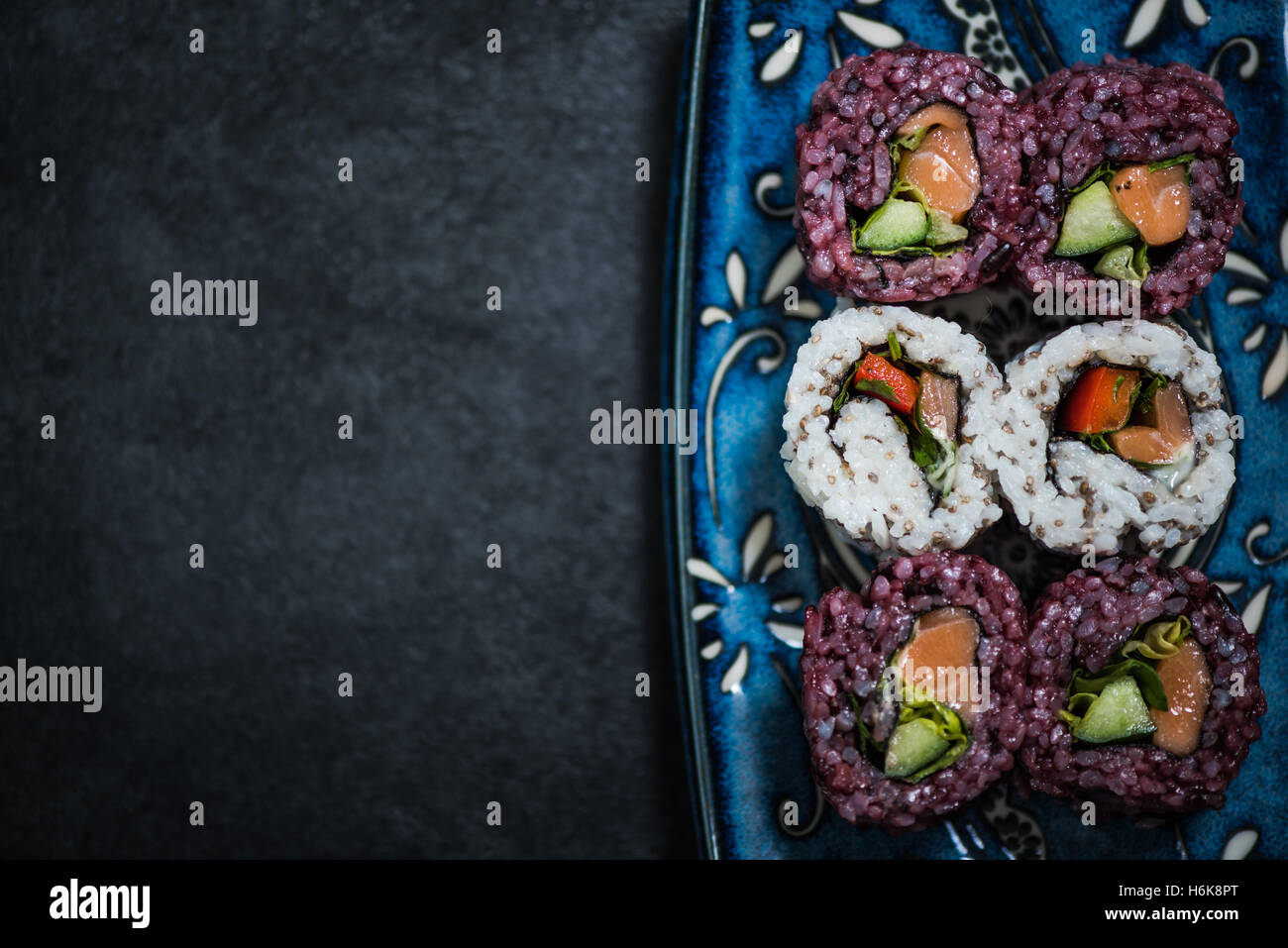 Black rice and chia seed sushi, raw healthy food. Novelty and alternative dish. Stock Photo