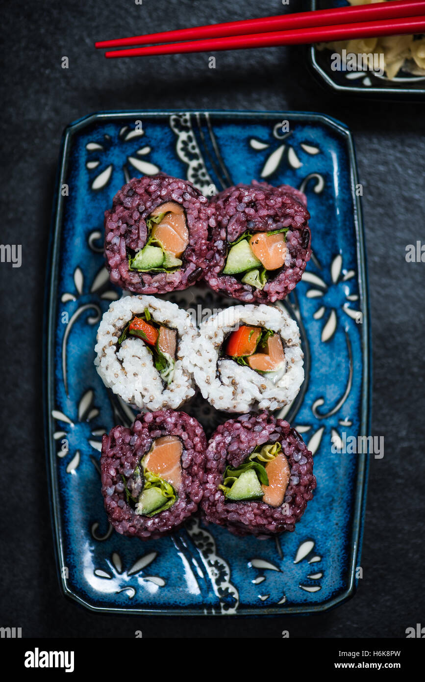 Black rice and chia seed sushi, raw healthy food. Novelty and alternative dish. Stock Photo