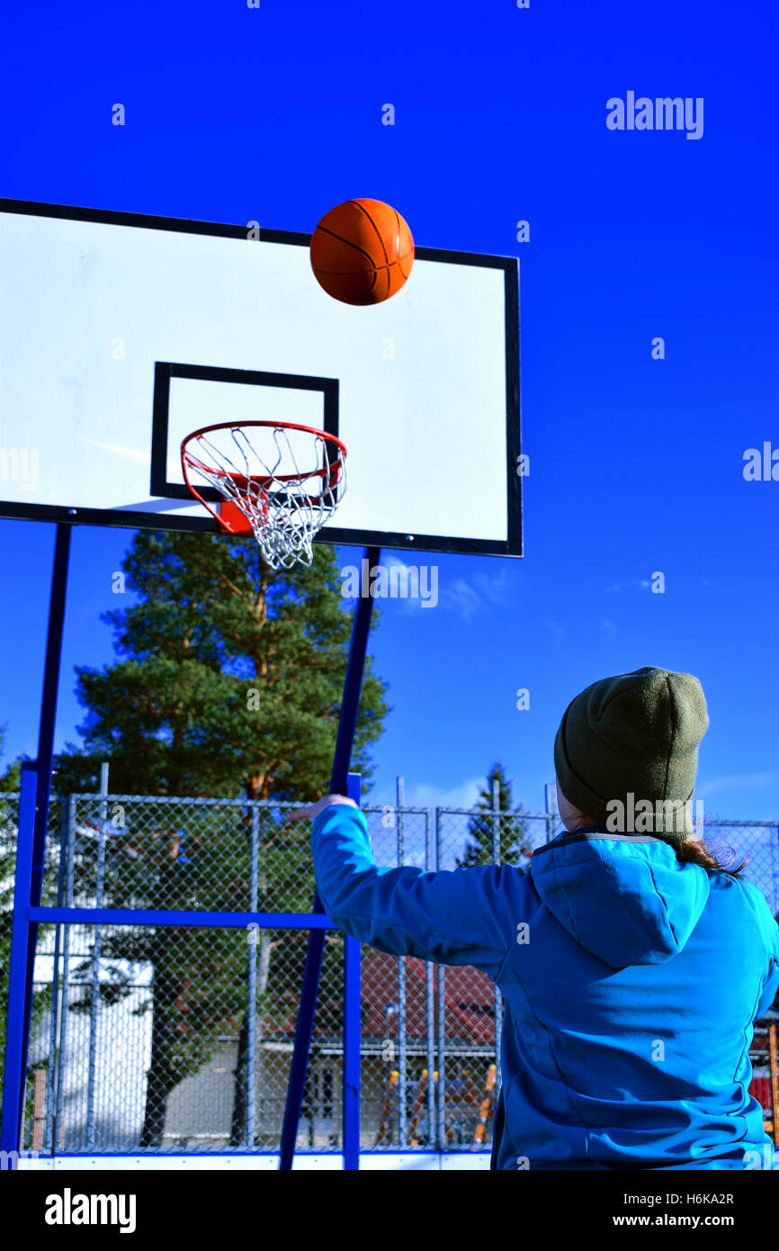 Teen girl throwing basket ball Stock Photo Alamy