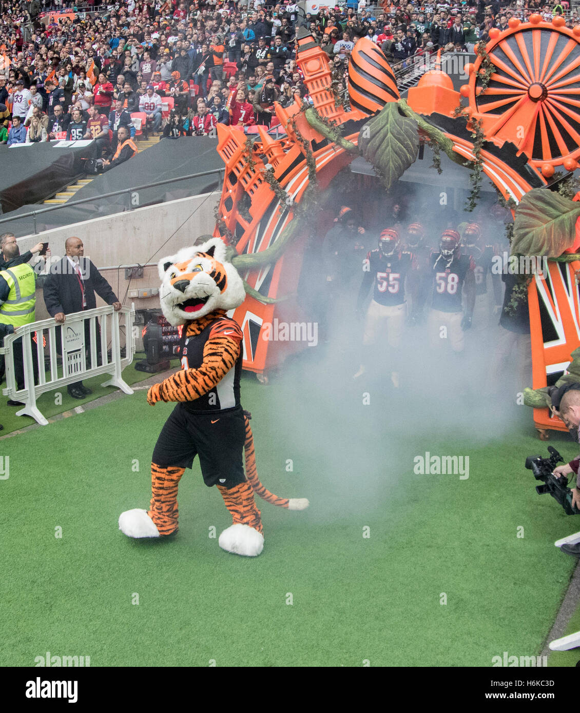 Wembley Stadium, London, UK. 30th Oct, 2016. NFL International Series. Cincinnati Bengals versus Washington Redskins. The Cincinnati Bengals team mascot WHO-DEY leads the team as it is introduced to the stadium fans through their team arch before the game. © Action Plus Sports/Alamy Live News Stock Photo