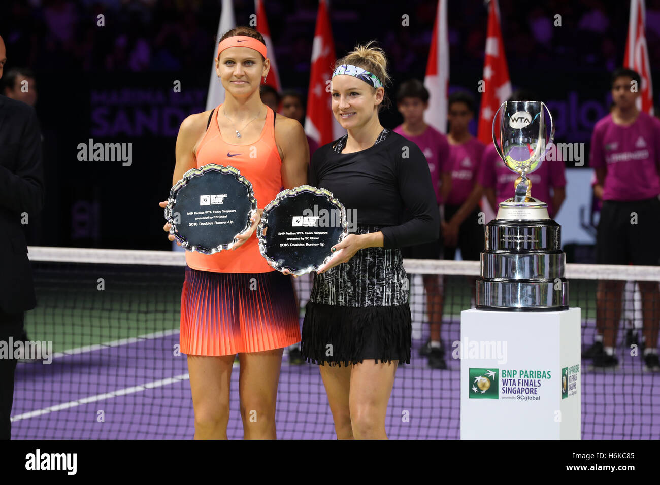 Singapore indoor stadium, Singapore. 30th October, 2016. BNP Paribas WTA finals women tennis association American player Bethanie Mattek-Sands and Czech player Lucie Safarova with their trophees after the double final. Credit:  Yan Lerval/Alamy Live News Stock Photo