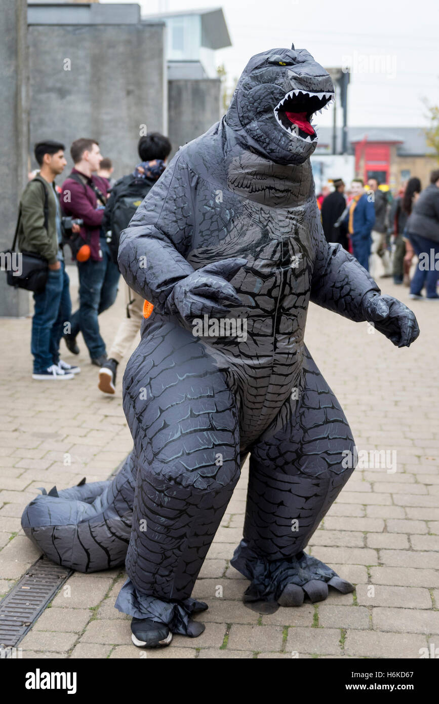 London, UK. 30 October 2016. A man dresses in an inflatable Godzilla costume,  as cosplay, anime, games and movie fans attend the popular MCM Comic Con  festival at Excel in Docklands. Credit: