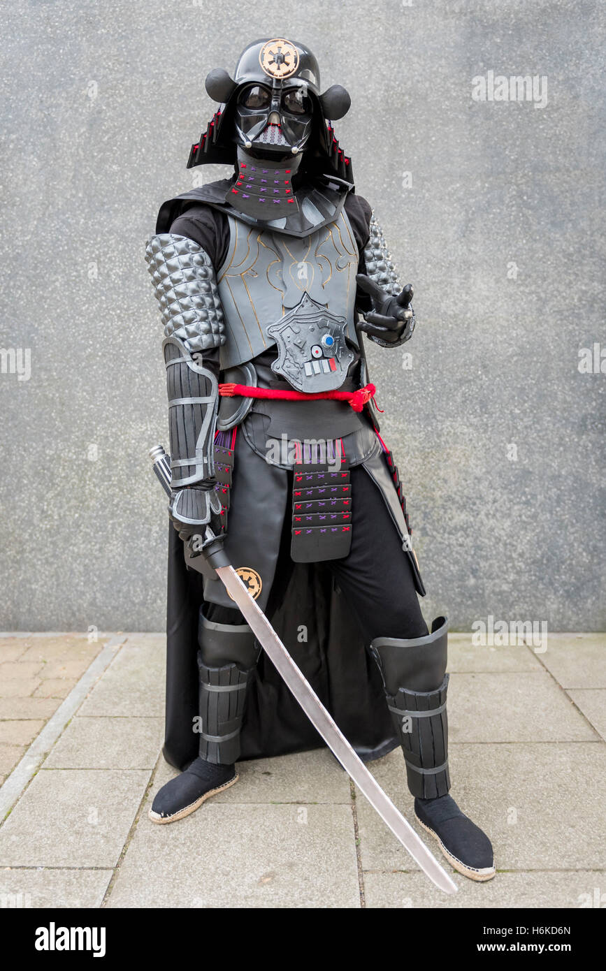 London, UK. 30 October 2016. A man dresses as Samurai Darth Vader, an  action figure, as cosplay, anime, games and movie fans attend the popular  MCM Comic Con festival at Excel in