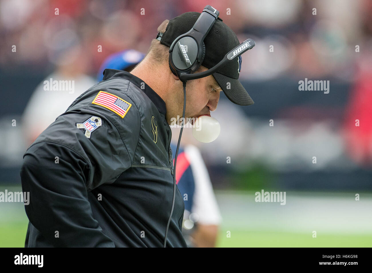 Houston, Texas, USA. 30th Oct, 2016. Houston Texans head coach Bill O'Brien blows a bubble during the 2nd quarter of an NFL game between the Houston Texans and the Detroit Lions at NRG Stadium in Houston, TX on October 30th, 2016. The Texans won the game 20-13. Credit:  Trask Smith/ZUMA Wire/Alamy Live News Stock Photo
