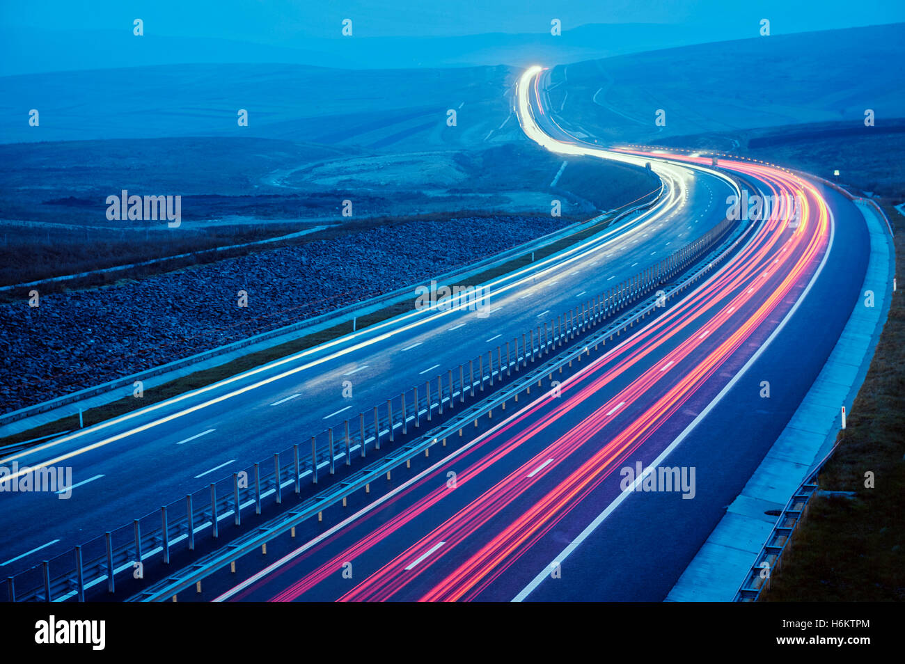 Modern rural motorway with traffic lights trail Stock Photo