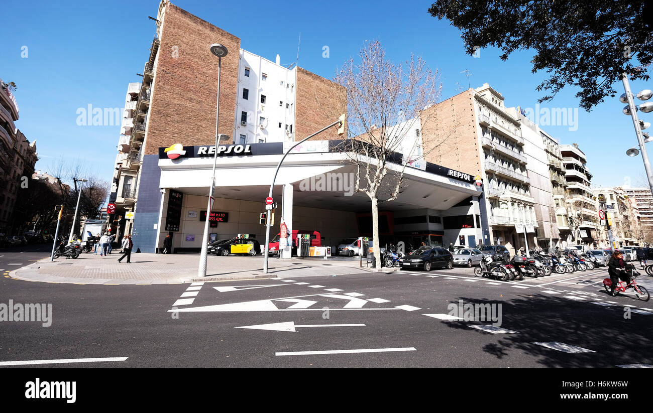 A street corner in Barcelona with a Repsol petrol station on the junction, Spain Stock Photo