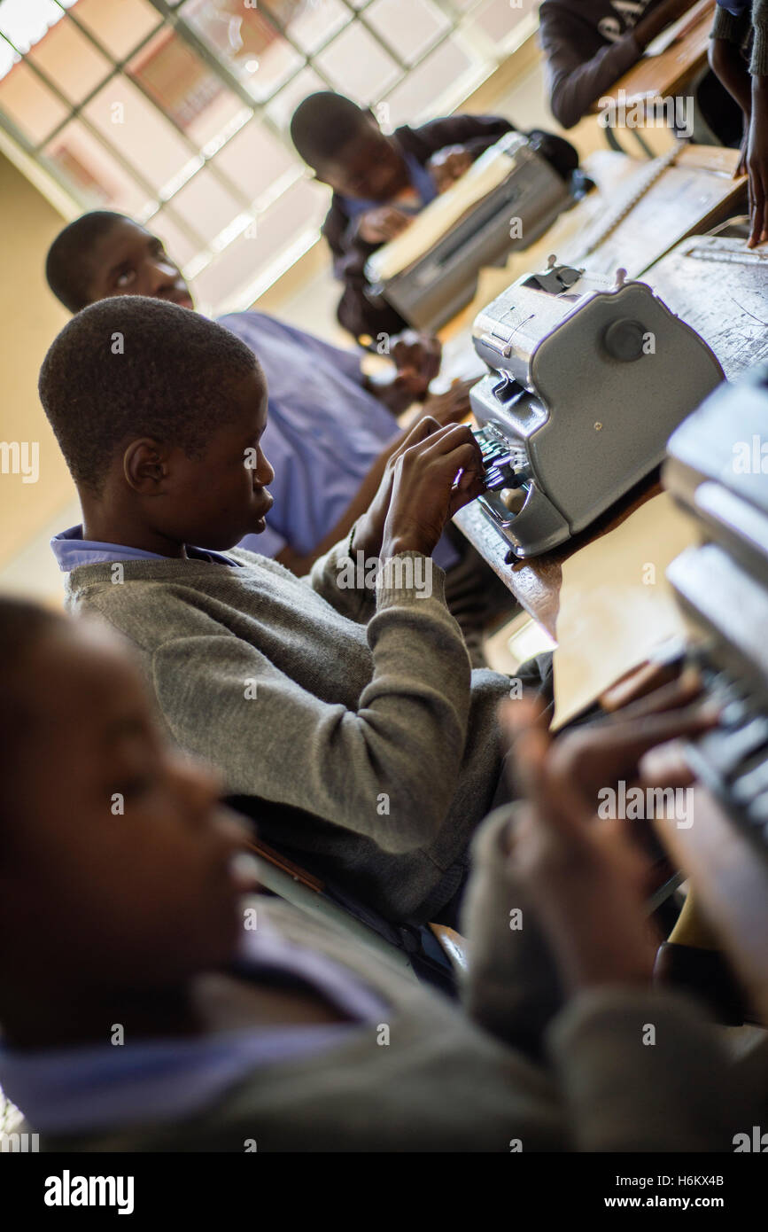 Learners of the Eluwa Special School types on a typewriter during