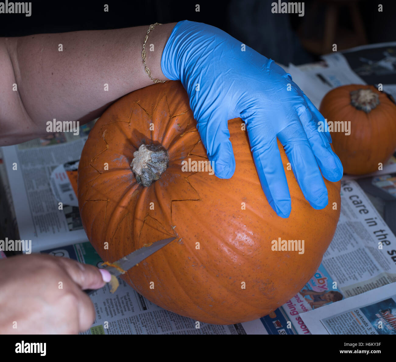 Pumkin carving - opening it up Stock Photo