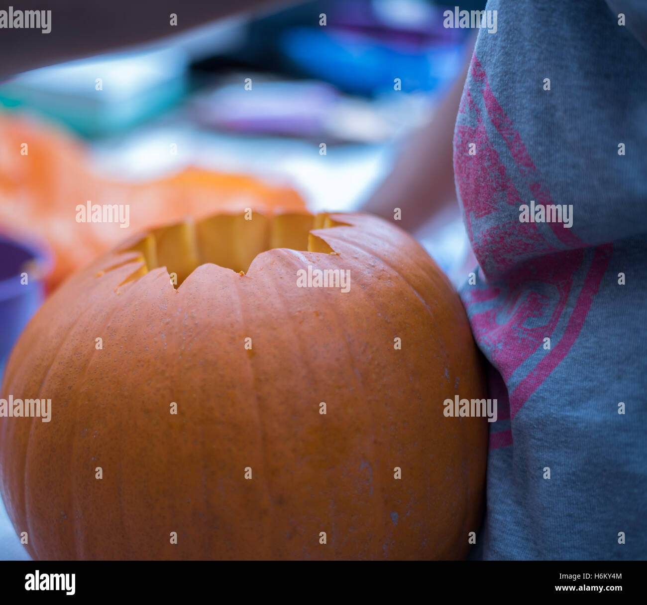 pumpkin carving- scooping out Stock Photo