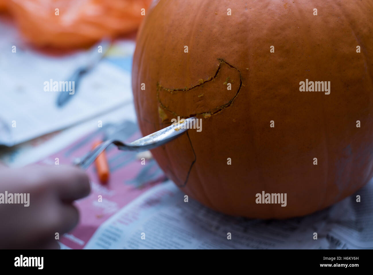 pumpkin caring- spoon bending Stock Photo