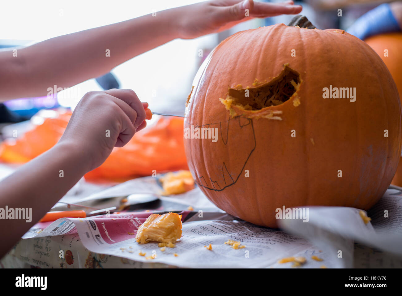 pumpkin carving, nearly finished Stock Photo