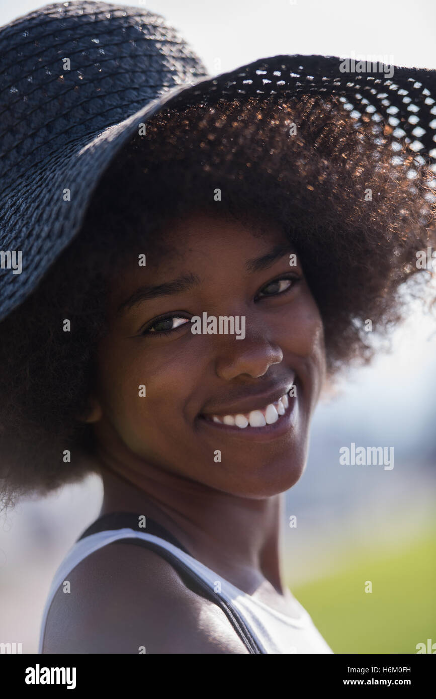 Close up portrait of a beautiful young african american woman smiling ...
