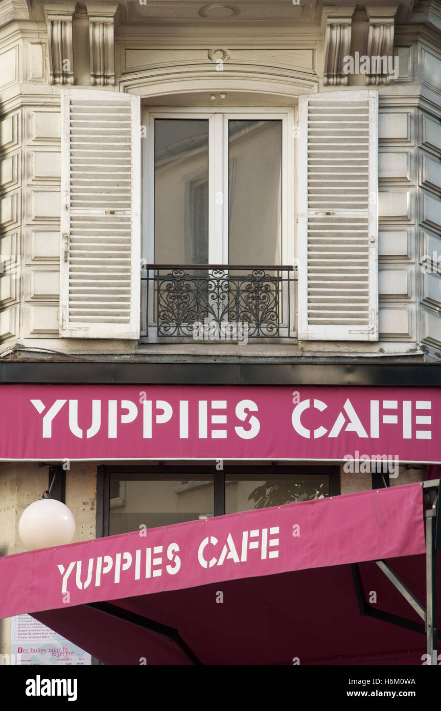 Amusing name. Detail of the exterior and purple awnings of the upmarket “Yuppies Café”, close to the fashionable Champs-Élysées, Paris, France. Stock Photo