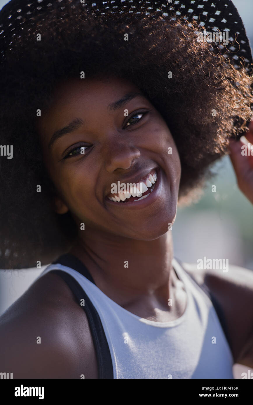 Close up portrait of a beautiful young african american woman smiling ...
