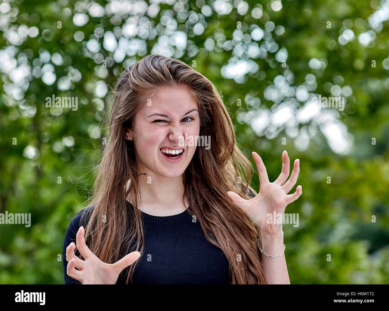 Young woman with crazy eyes and wicked expression Stock Photo Alamy